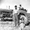 Anthony Marshall, Joe W. Francis and unknown sitting on tractor. Maine potatoe picking. (Viola Christmas Collection)