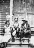 Frank Herney, Steven Tobin and mary A. Marshall sitting on steps.(Charlie Herney Collection)