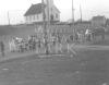 Parade on Membertou Street, St. Anne's church in background. (Viola Christmas Collection)